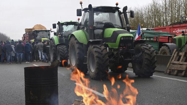 Farmers block roads across France in protest over low wages and regulations